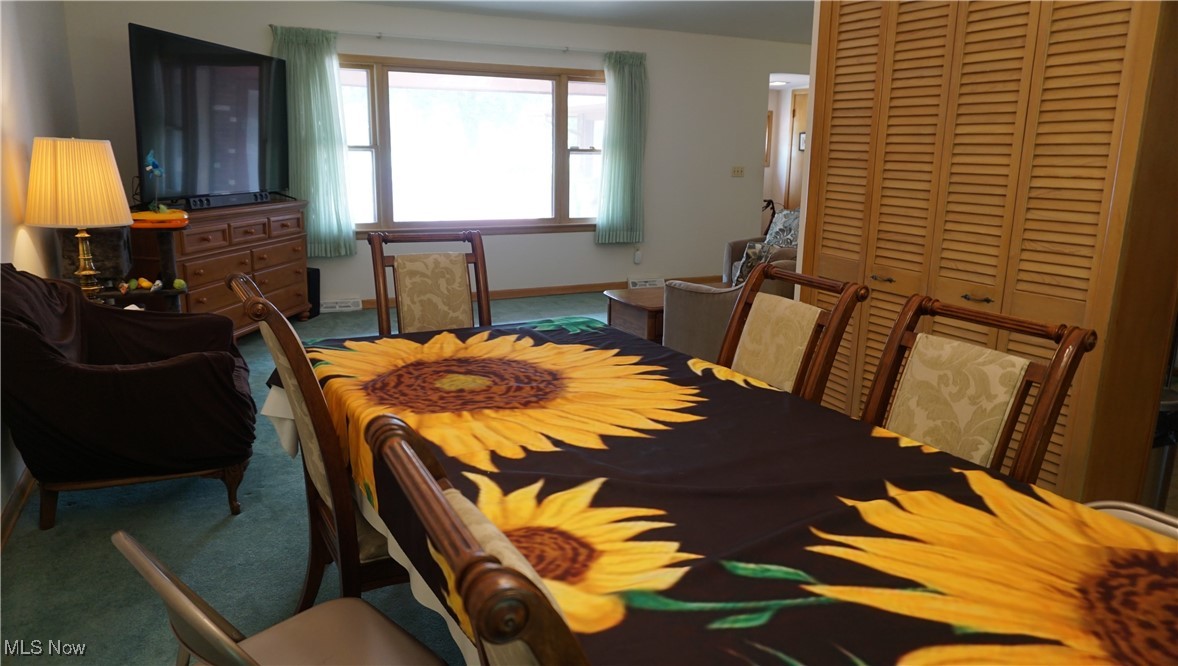 2100 West Pleasant Valley Road Cleveland, OH 44134 - Photo 8 of 30 Carpeted dining room with baseboards