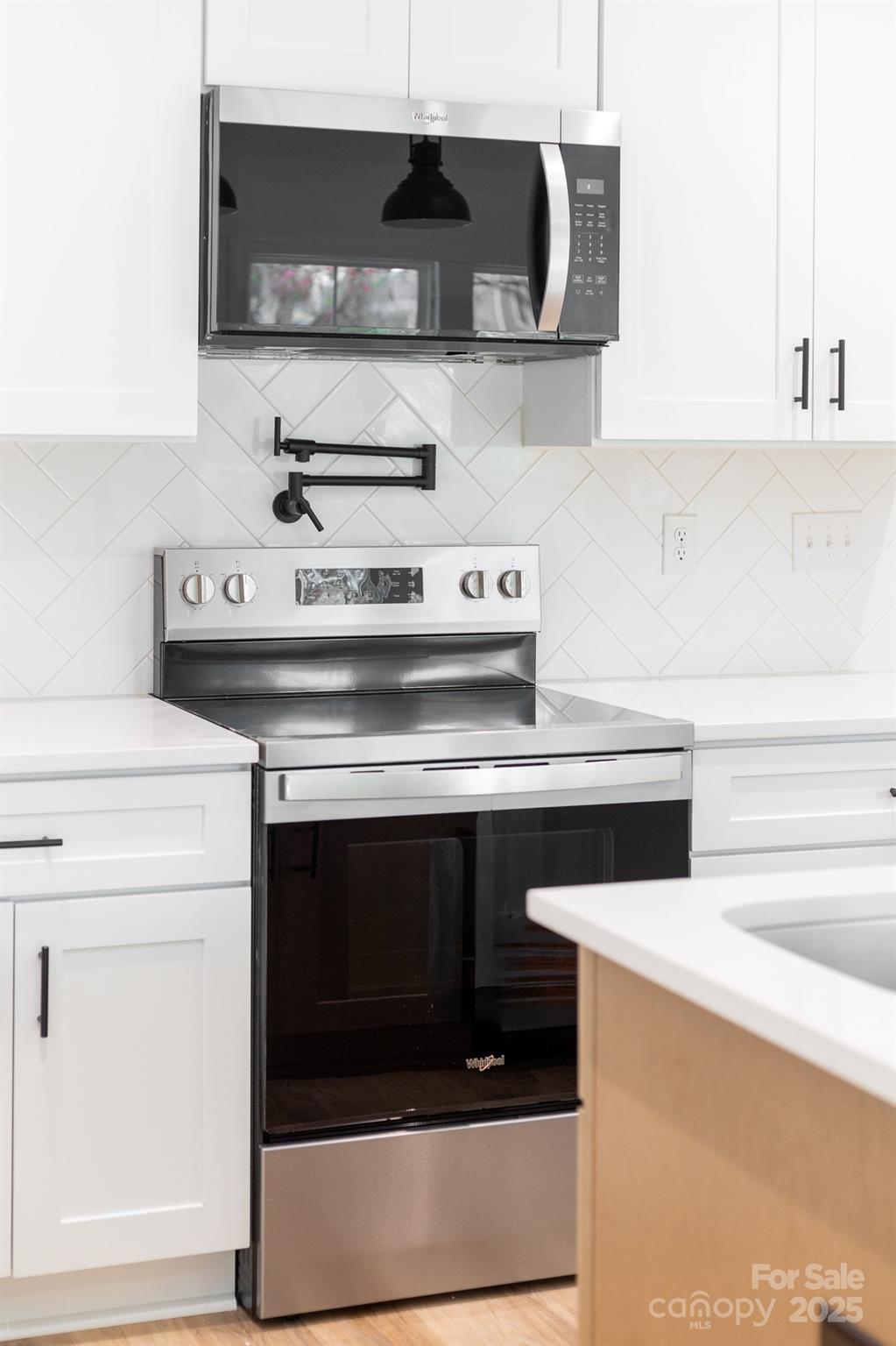 103 West Irwin Street Cherryville, NC 28021 - Photo 14 of 30 a stove top oven sitting inside of a kitchen