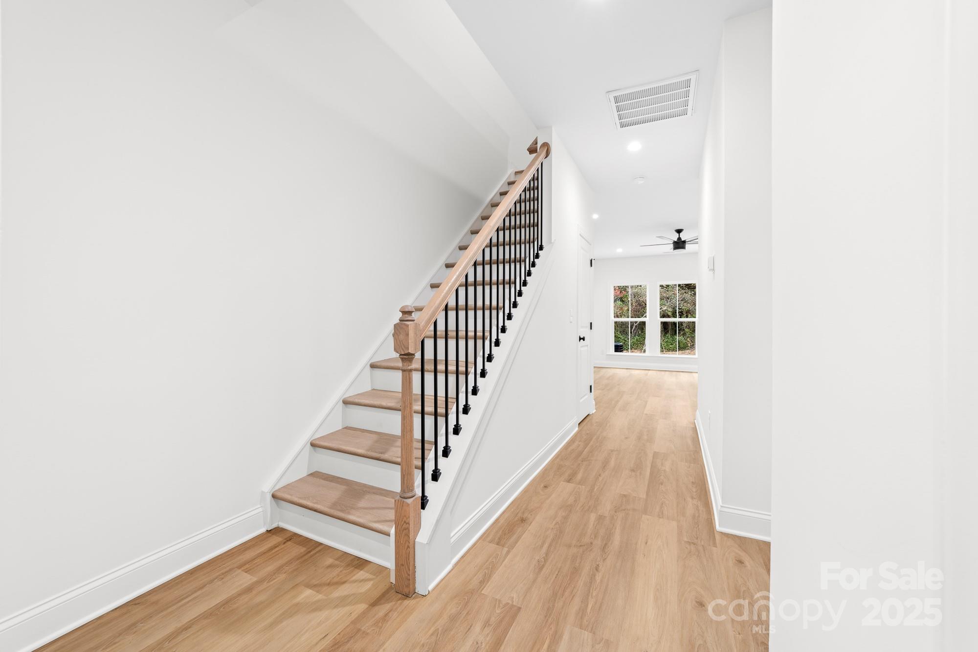 103 West Irwin Street Cherryville, NC 28021 - Photo 15 of 30 a view of entryway with wooden floor