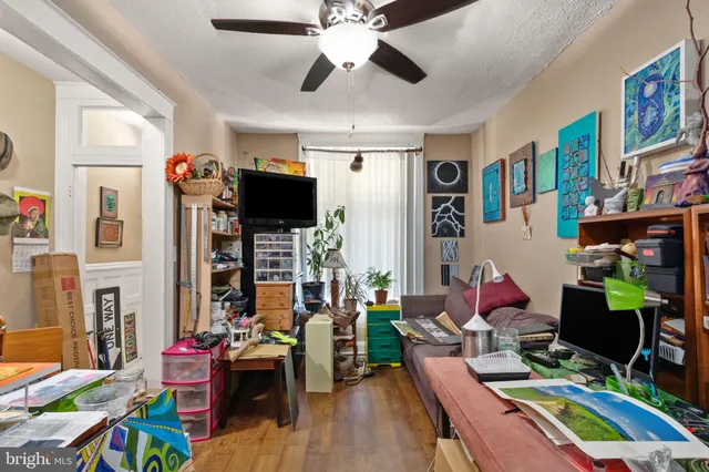 a living room filled with furniture and a chandelier