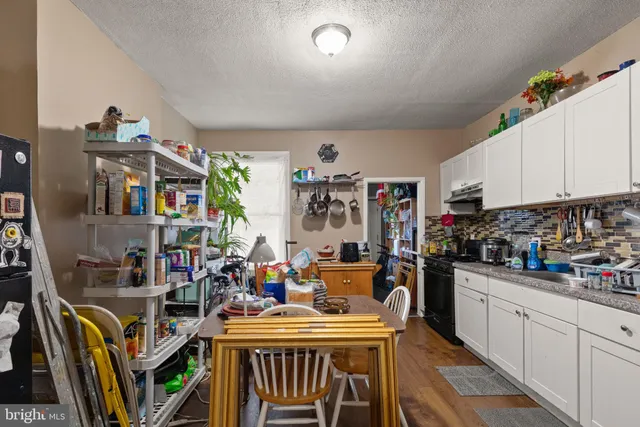 a view of a kitchen and dining room