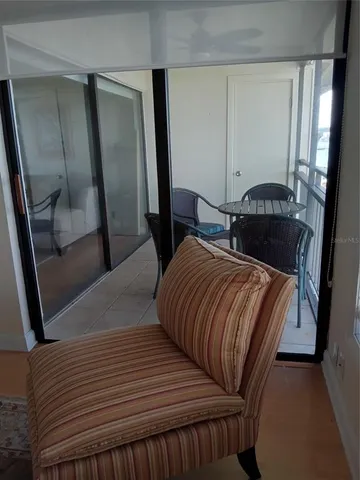 a living room with furniture and wall painting