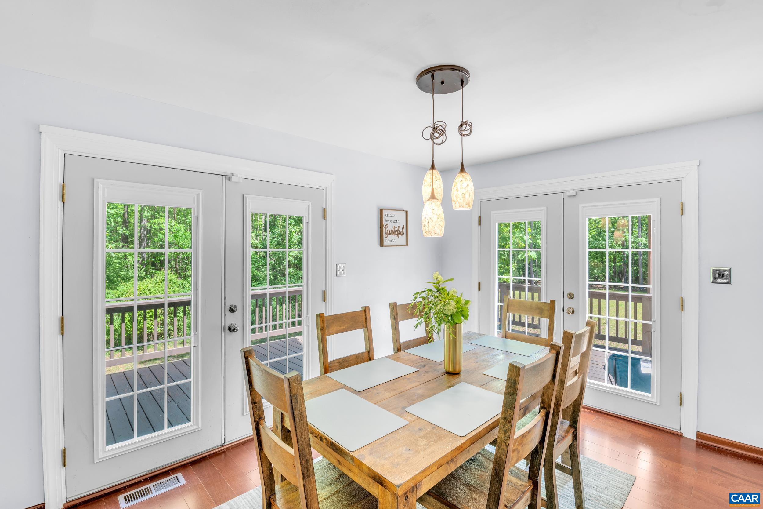 3101 Martin Kings Road Charlottesville, VA 22902 - Photo 35 of 60 a view of a dining room with furniture window and wooden floor