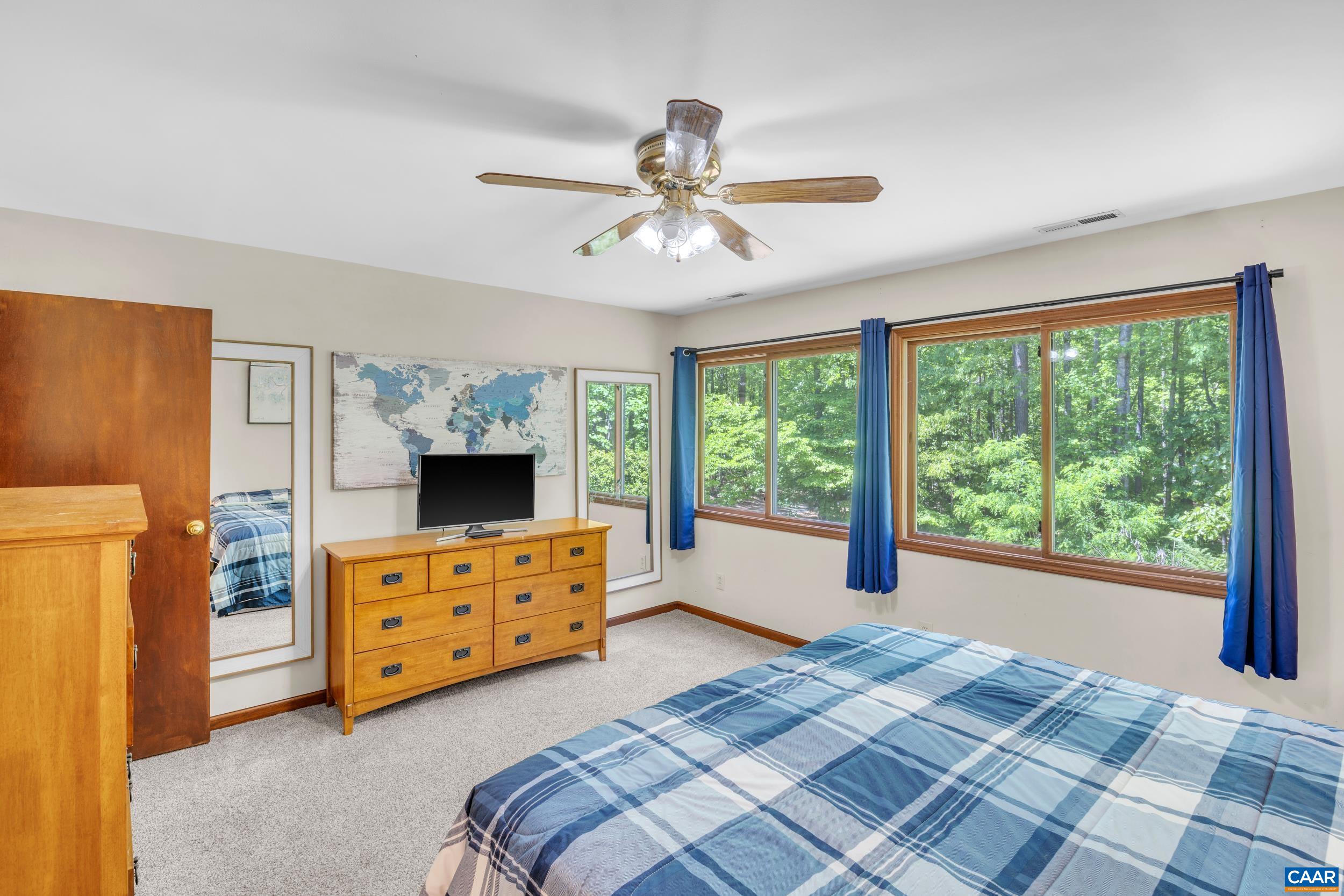3101 Martin Kings Road Charlottesville, VA 22902 - Photo 42 of 60 a bedroom with a bed and a dresser