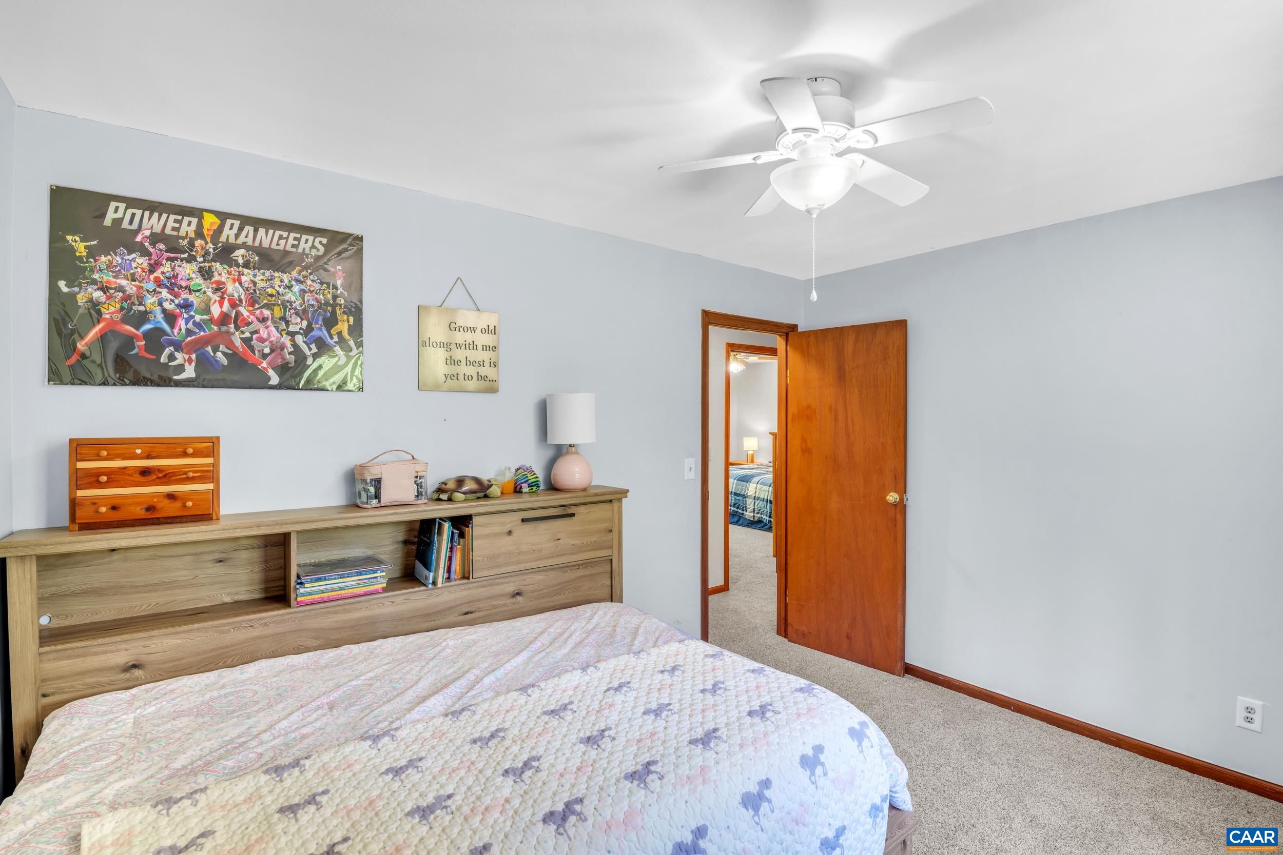 3101 Martin Kings Road Charlottesville, VA 22902 - Photo 50 of 60 a bedroom with a large bed and a chandelier