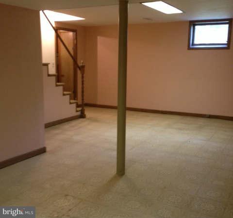 1026 St Albans Road Baltimore, MD 21239 - Photo 14 of 16 an empty room with windows