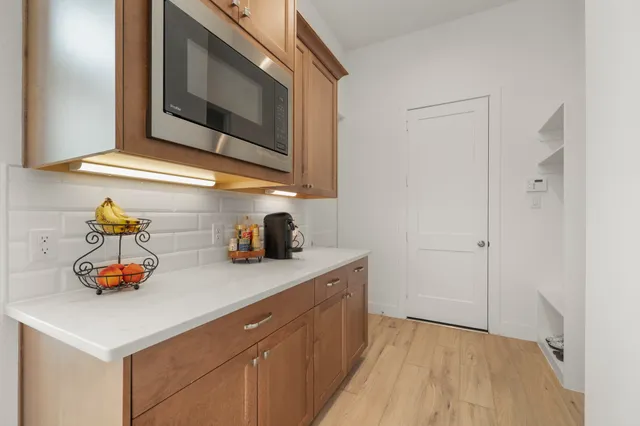 a kitchen with sink and cabinets