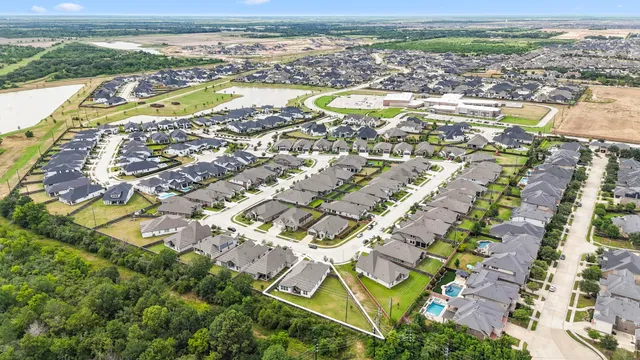 an aerial view of residential building and lake