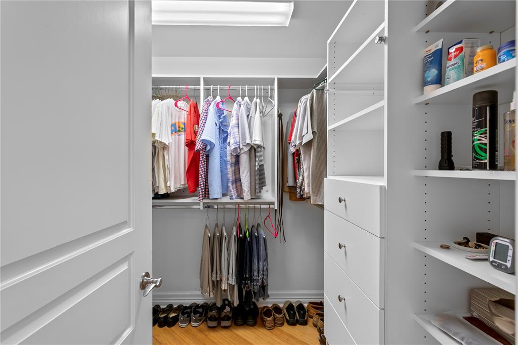19730 Gulf Boulevard, Unit 400 Indian Rocks Beach, FL 33785 - Photo 44 of 90 a view of walk in closet with clothes and shoes