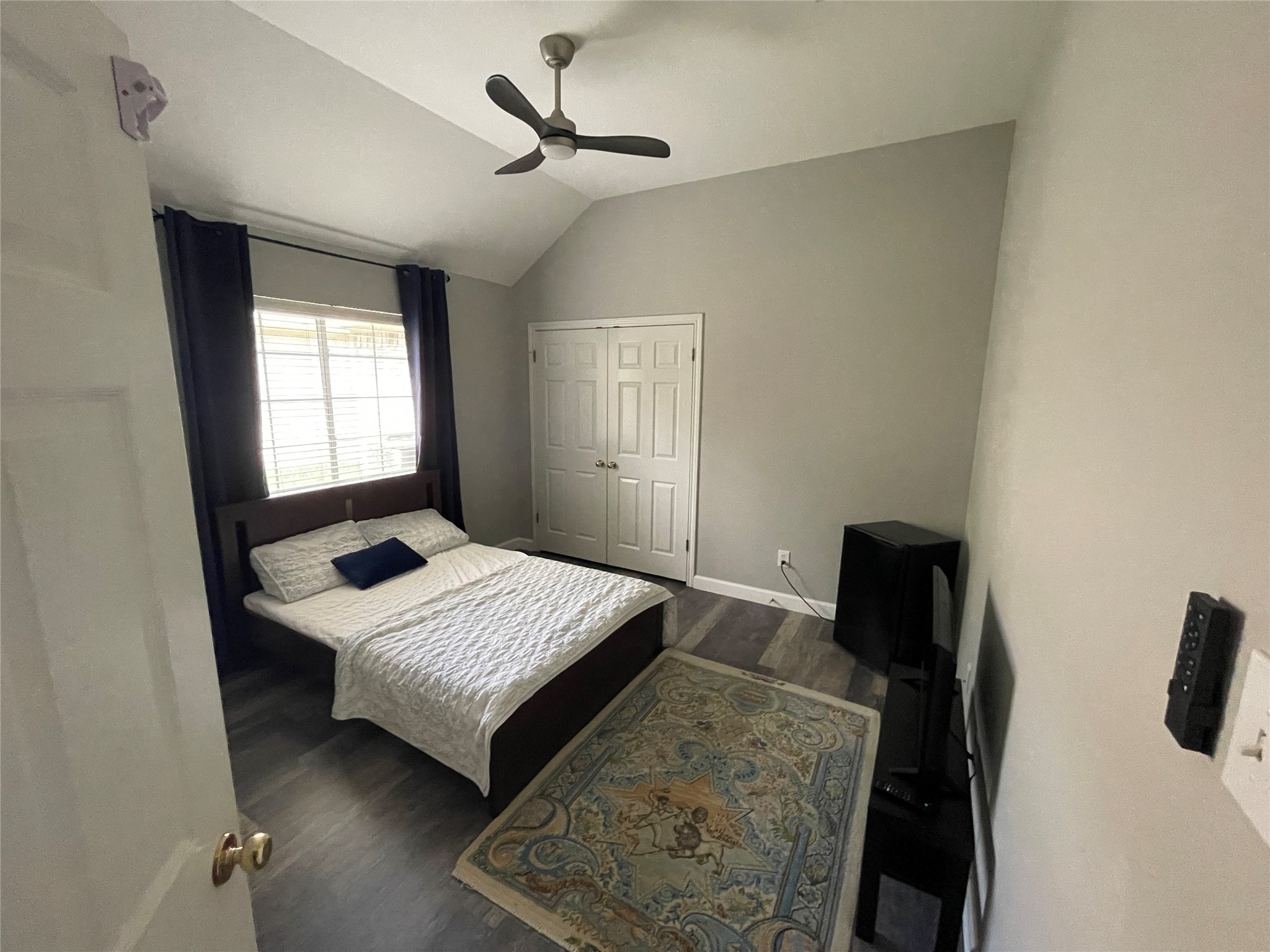 3023 Bent Tree Loop Round Rock, TX 78681 - Photo 15 of 18 Bedroom featuring vaulted ceiling, dark wood finished floors, a ceiling fan, and a closet