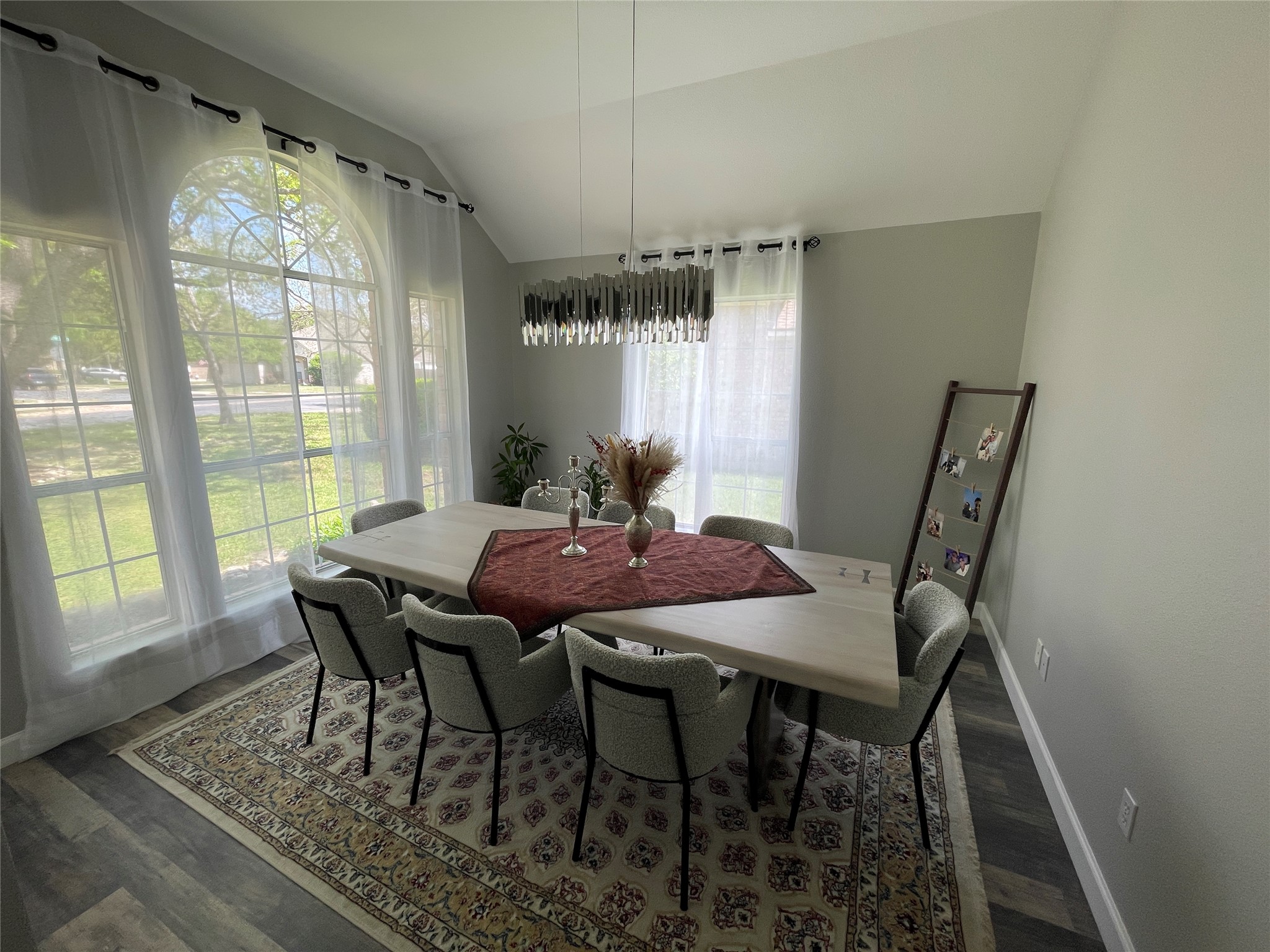 3023 Bent Tree Loop Round Rock, TX 78681 - Photo 3 of 18 Dining room featuring vaulted ceiling and dark wood finished floors