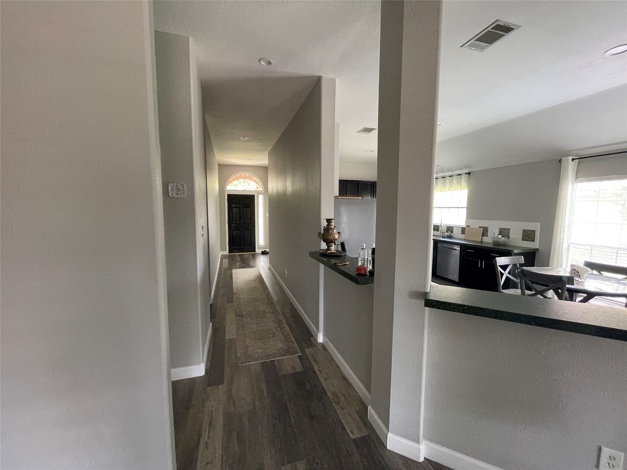 3023 Bent Tree Loop Round Rock, TX 78681 - Photo 5 of 18 Corridor featuring dark wood-style floors and baseboards