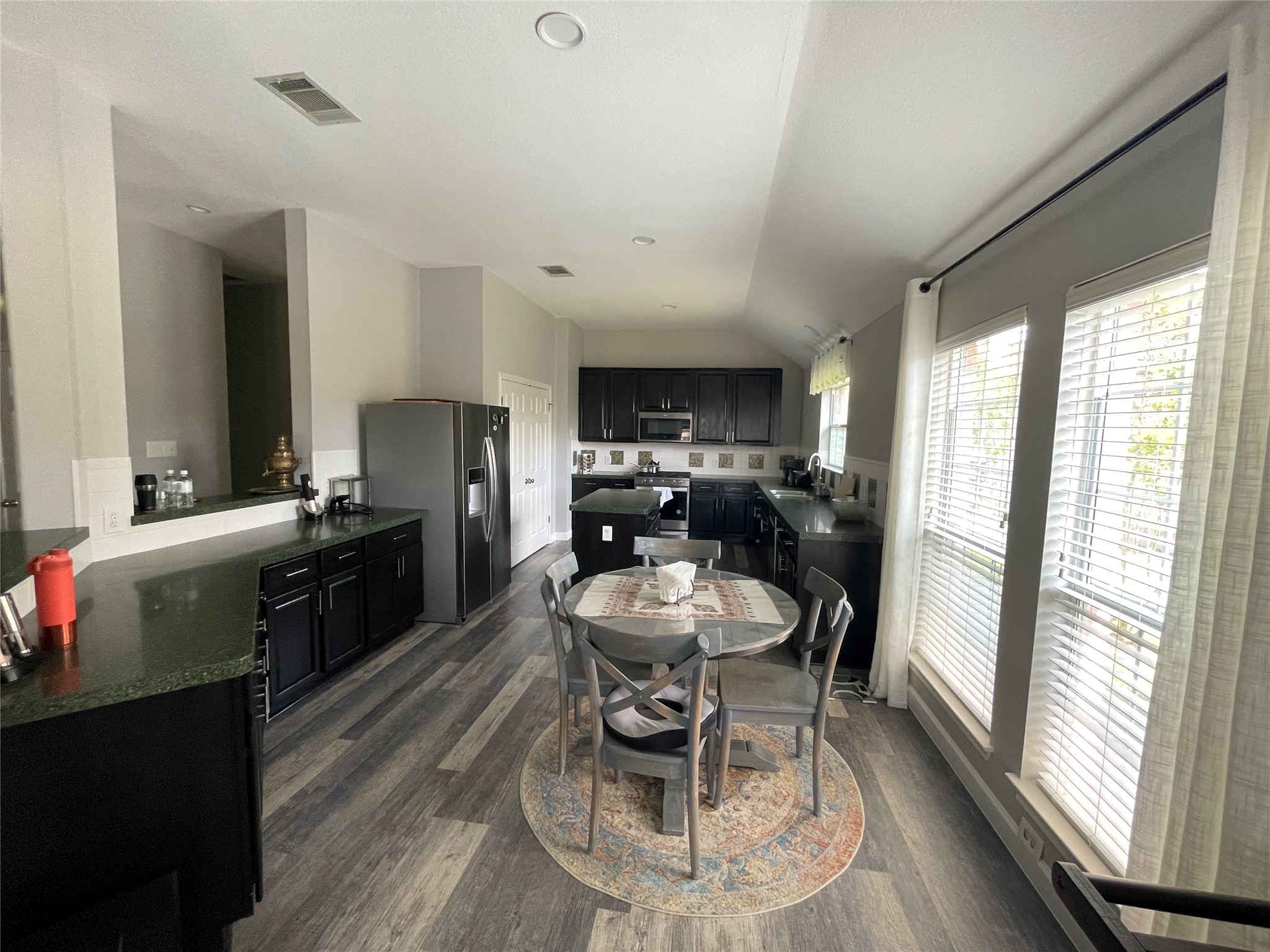 3023 Bent Tree Loop Round Rock, TX 78681 - Photo 6 of 18 Dining space with dark wood-type flooring and lofted ceiling