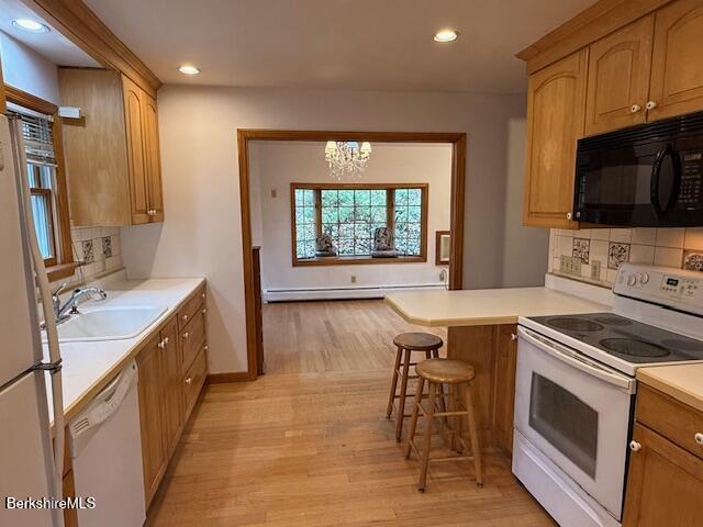 100 North Hoosac Road Williamstown, MA 01267 - Photo 5 of 25 a kitchen with stainless steel appliances a stove a sink and a microwave