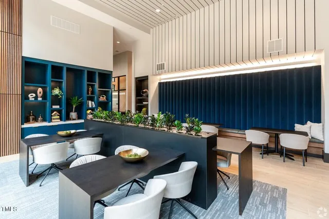 a outdoor dining space with furniture and rug