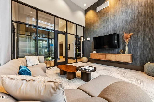 a living room with furniture and a flat screen tv