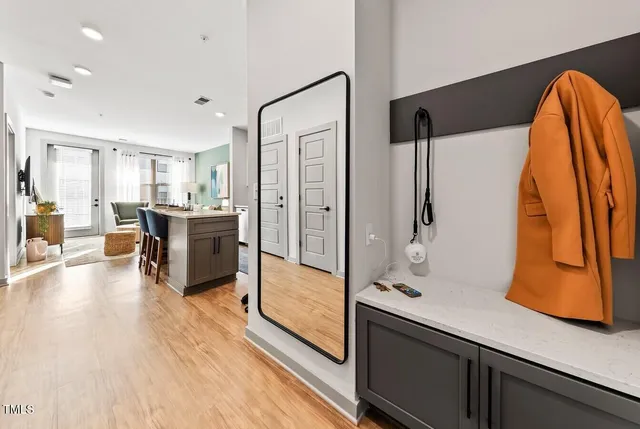 a kitchen with stainless steel appliances kitchen island granite countertop a refrigerator and a stove