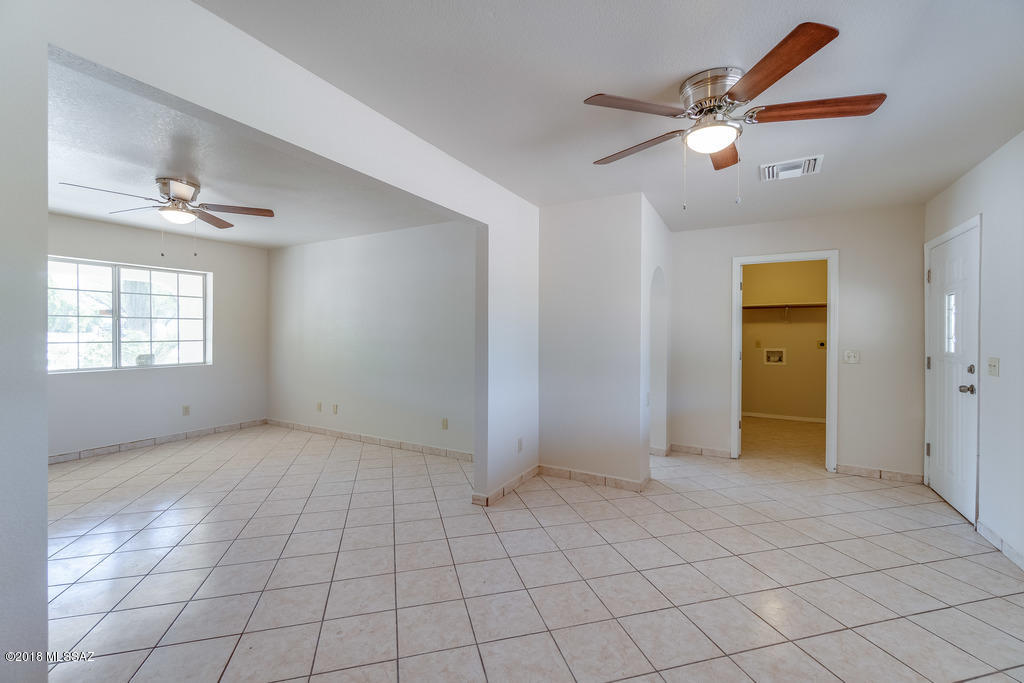 549 Valdez Court Rio Rico, AZ 85648 - Photo 14 of 27 an empty room with fan and windows
