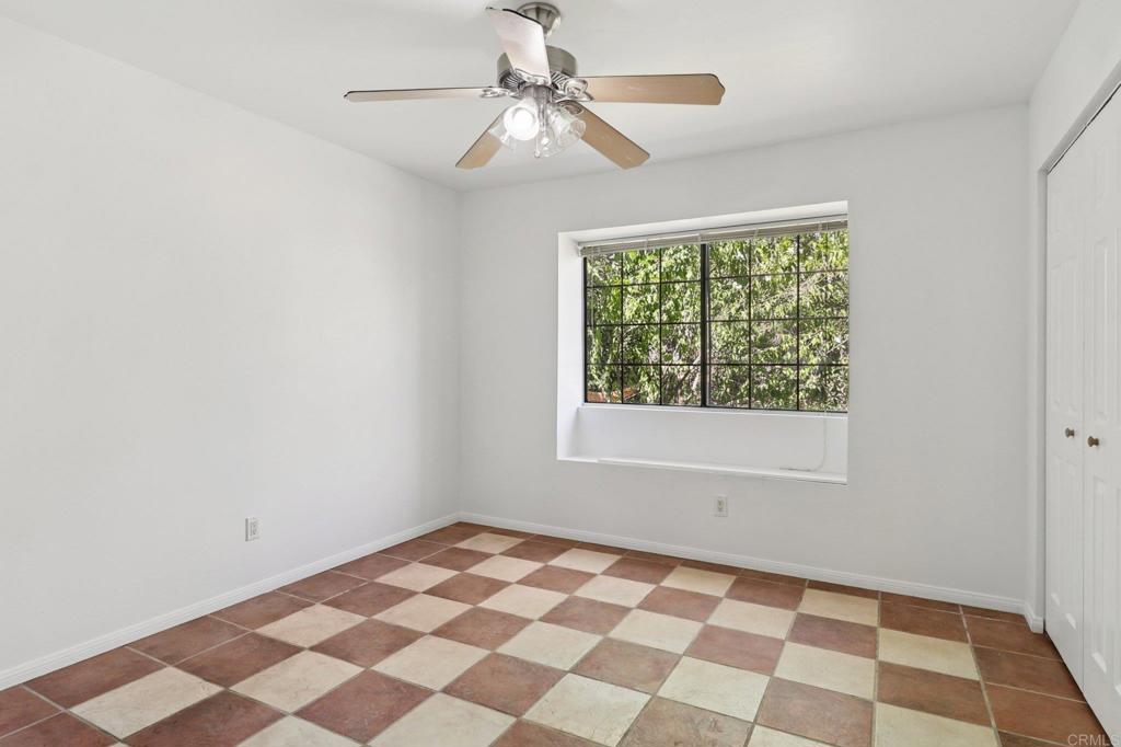 23833 Gymkhana Road Ramona, CA 92065 - Photo 12 of 29 a view of a bedroom with a black and white checkered floor