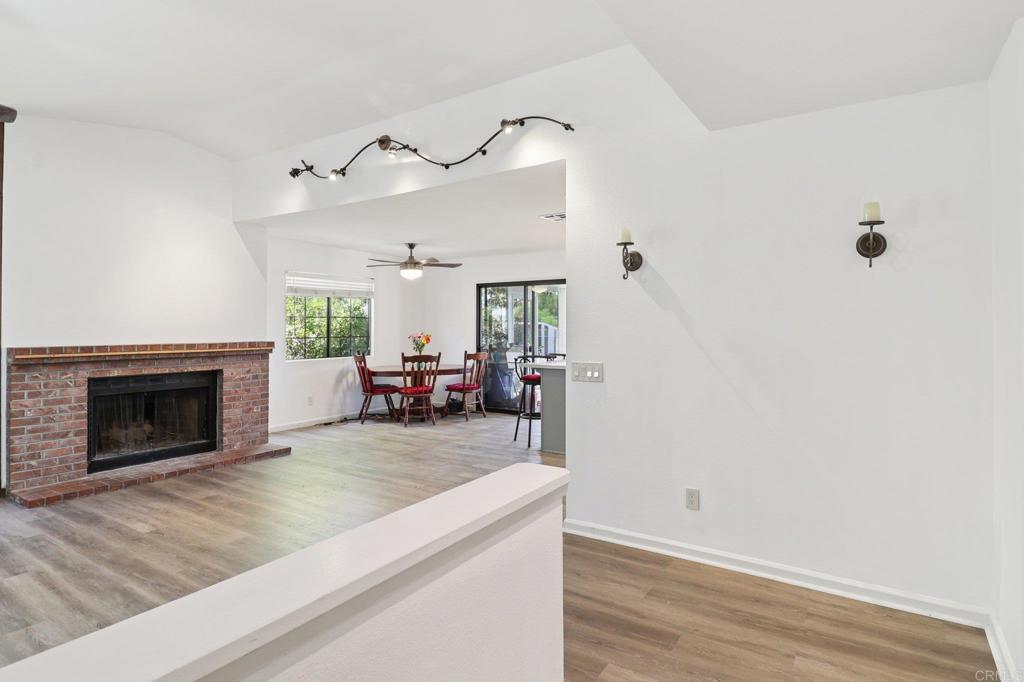 23833 Gymkhana Road Ramona, CA 92065 - Photo 2 of 29 a living room with furniture and a fireplace