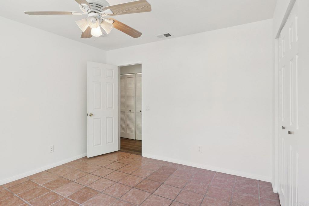 23833 Gymkhana Road Ramona, CA 92065 - Photo 21 of 29 an empty room with a fan and a fan