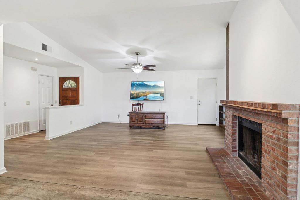 23833 Gymkhana Road Ramona, CA 92065 - Photo 4 of 29 a living room with furniture and a fireplace