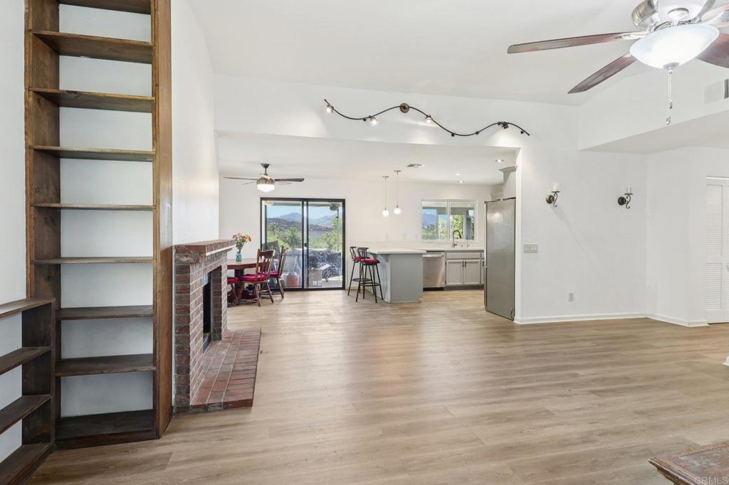 23833 Gymkhana Road Ramona, CA 92065 - Photo 6 of 29 a view of a livingroom with furniture and a ceiling fan