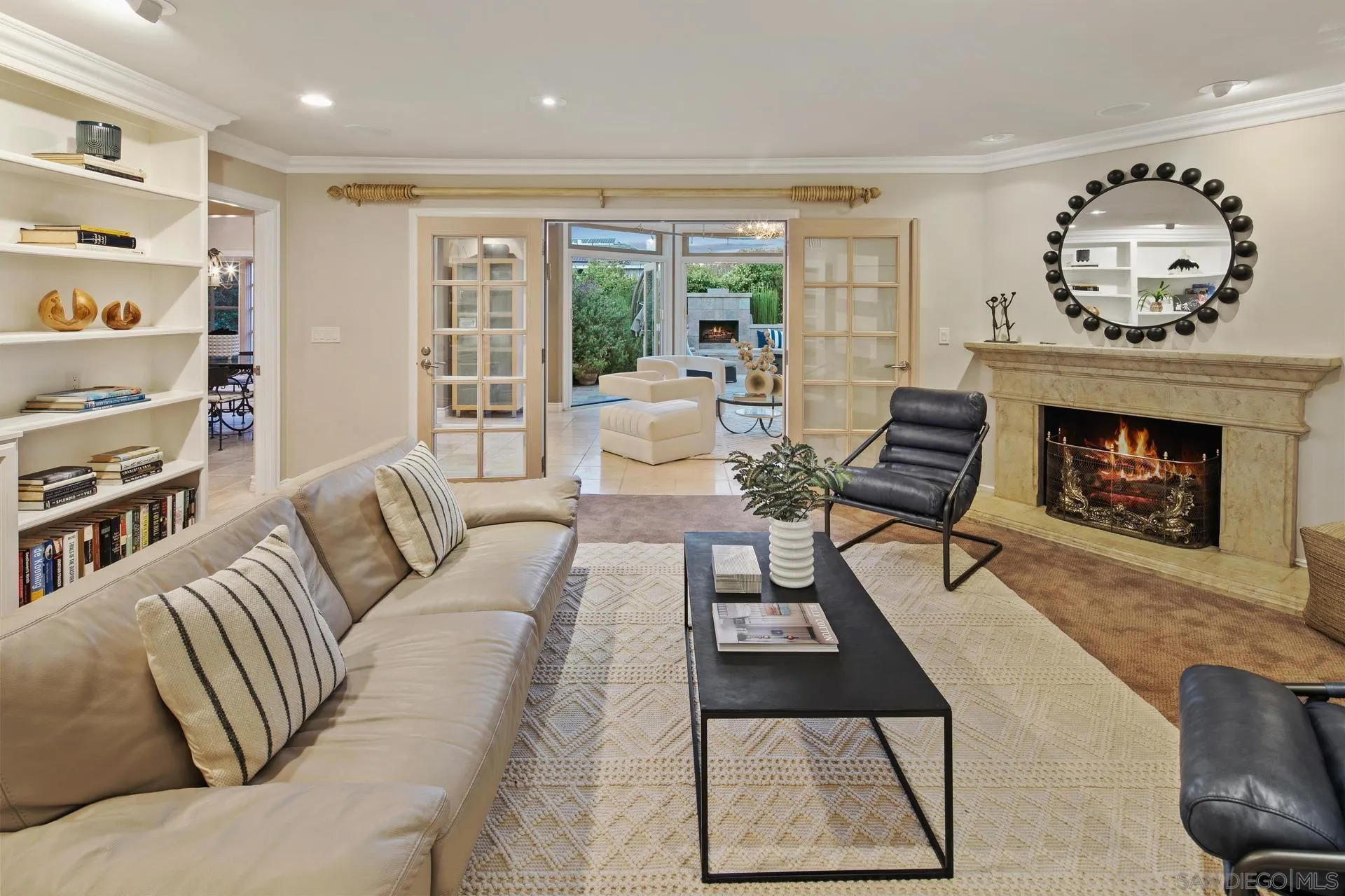 8491 Cliffridge Lane La Jolla, CA 92037 - Photo 18 of 38 a living room with furniture and a fireplace