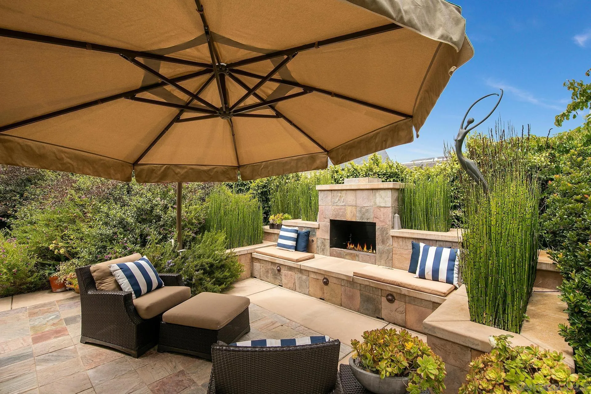 8491 Cliffridge Lane La Jolla, CA 92037 - Photo 19 of 38 a outdoor space with patio the couches and a umbrella