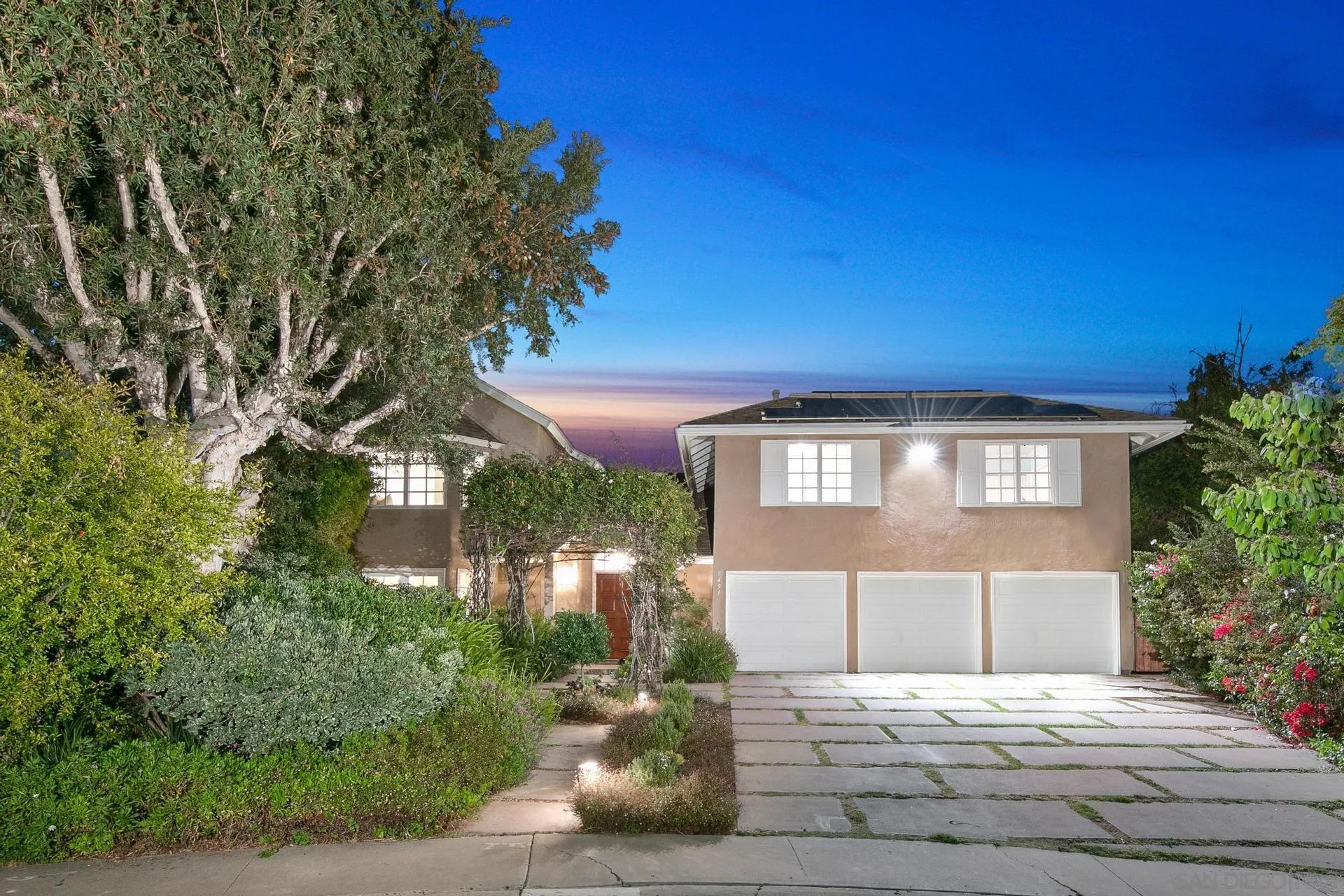 8491 Cliffridge Lane La Jolla, CA 92037 - Photo 2 of 38 a front view of a house with a yard