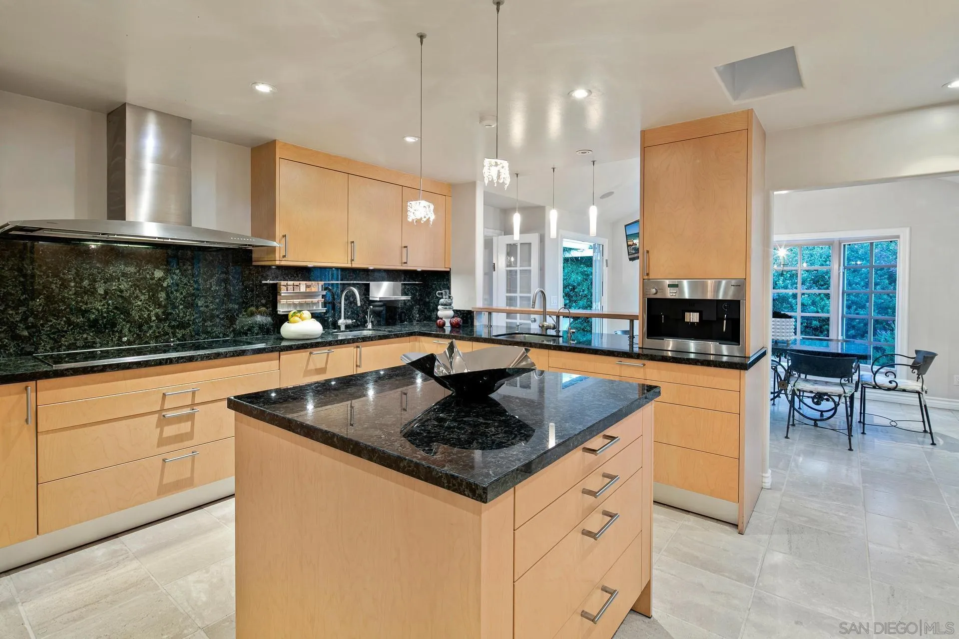 8491 Cliffridge Lane La Jolla, CA 92037 - Photo 25 of 38 a kitchen with stainless steel appliances granite countertop a sink a stove and a granite counter tops