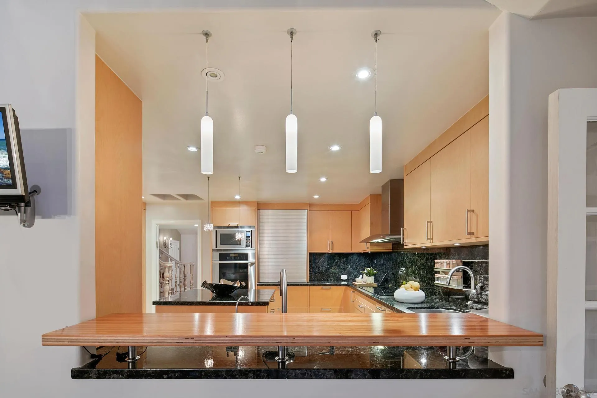 8491 Cliffridge Lane La Jolla, CA 92037 - Photo 26 of 38 a large room with lots of potted plants