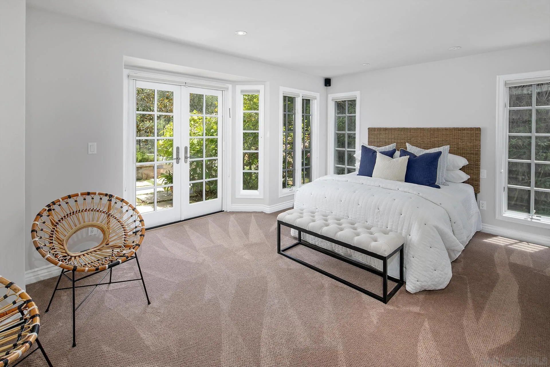 8491 Cliffridge Lane La Jolla, CA 92037 - Photo 29 of 38 a bedroom with a bed a table and chair