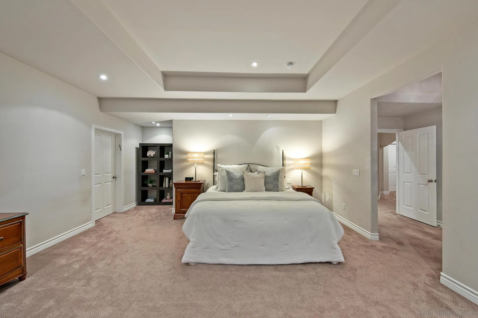 8491 Cliffridge Lane La Jolla, CA 92037 - Photo 31 of 38 a bedroom with a bed and lamp