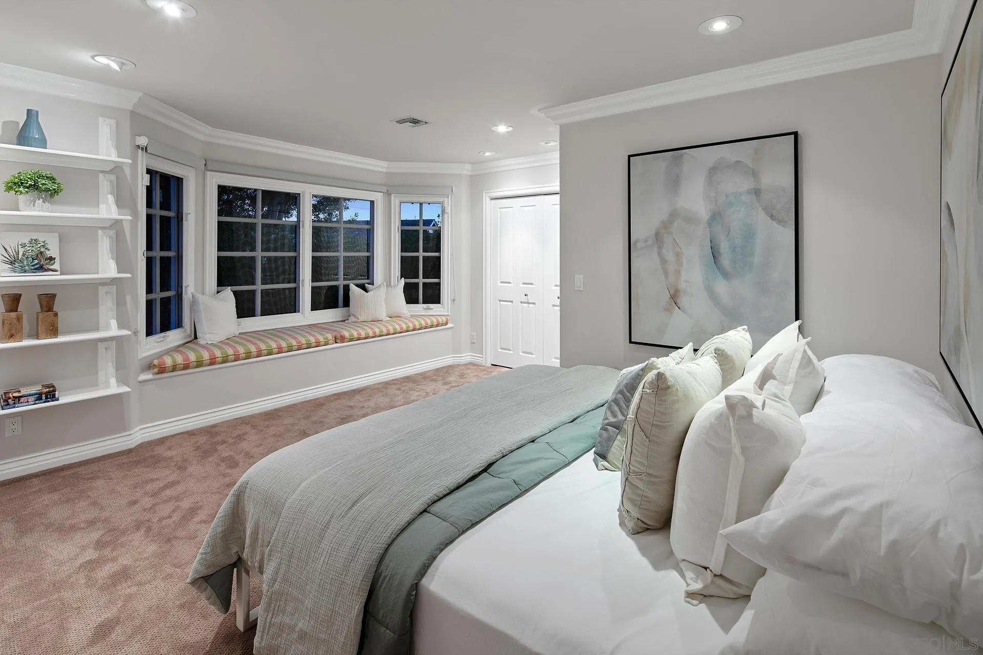 8491 Cliffridge Lane La Jolla, CA 92037 - Photo 32 of 38 a bedroom with a bed and a large window