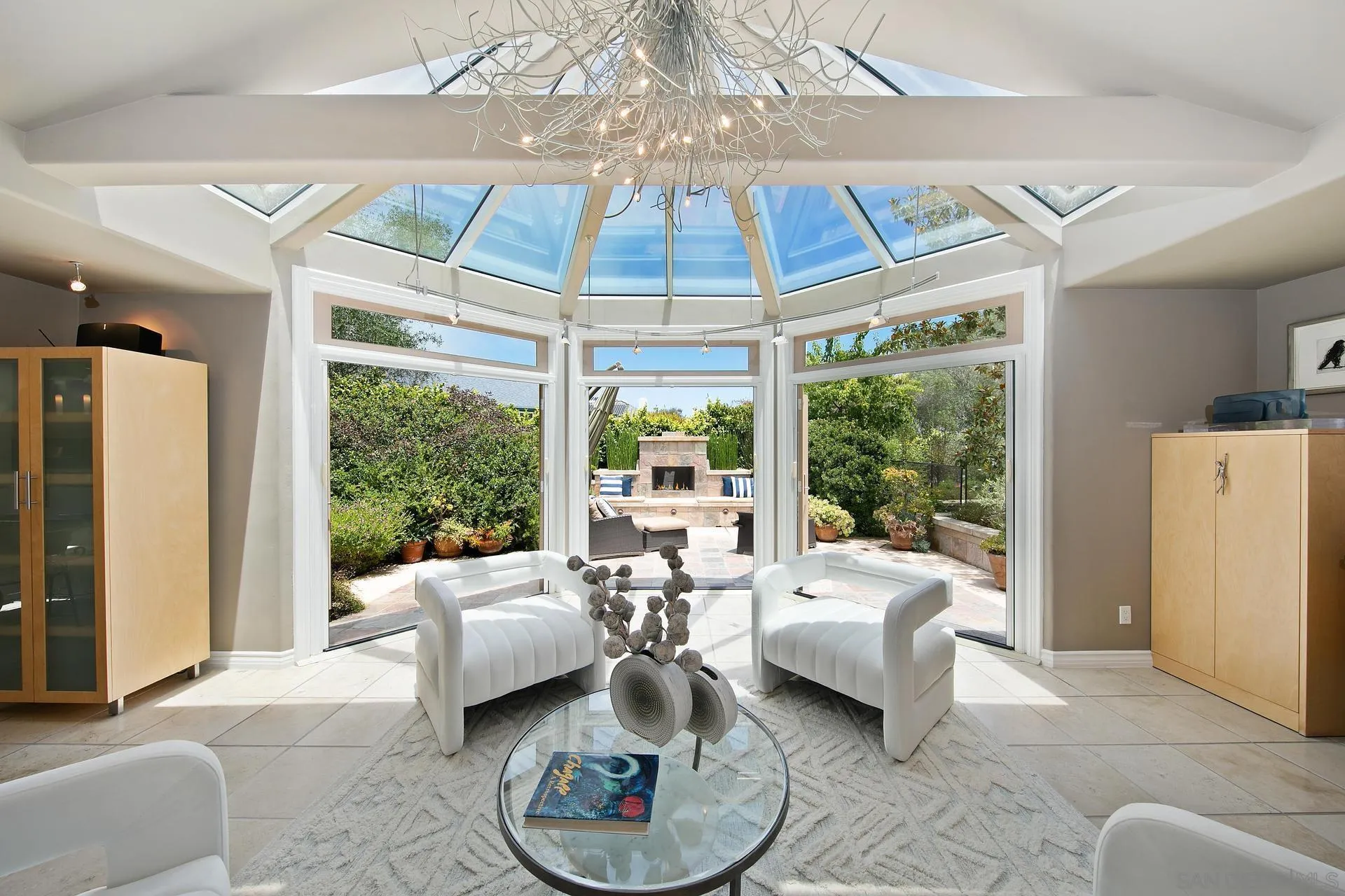 8491 Cliffridge Lane La Jolla, CA 92037 - Photo 4 of 38 a living room with furniture and a chandelier