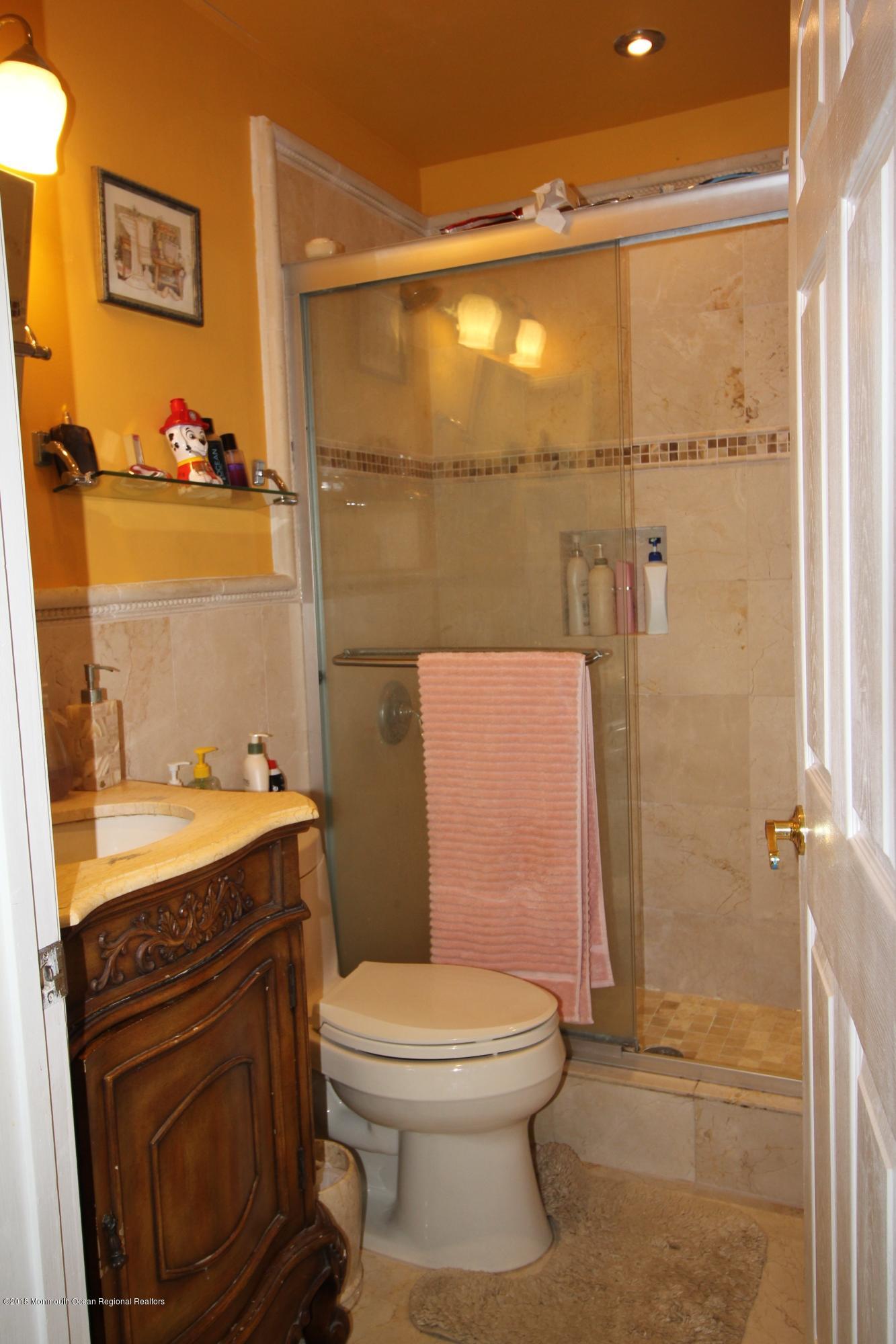 2007 Ridgeview Court, Unit 2007 Parlin, NJ 08859 - Photo 14 of 21 a bathroom with a sink a toilet and shower