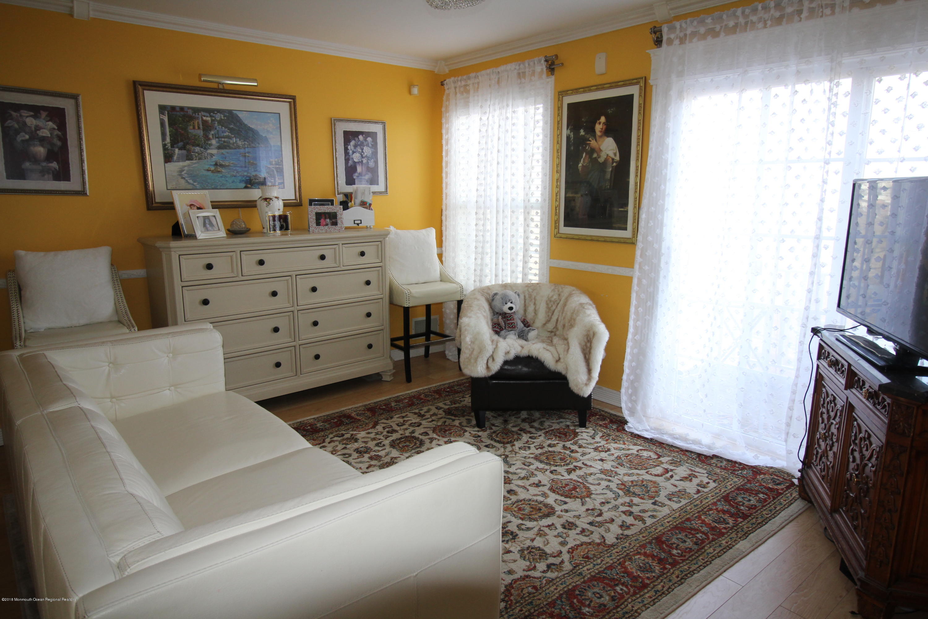 2007 Ridgeview Court, Unit 2007 Parlin, NJ 08859 - Photo 3 of 21 a living room with furniture and a flat screen tv