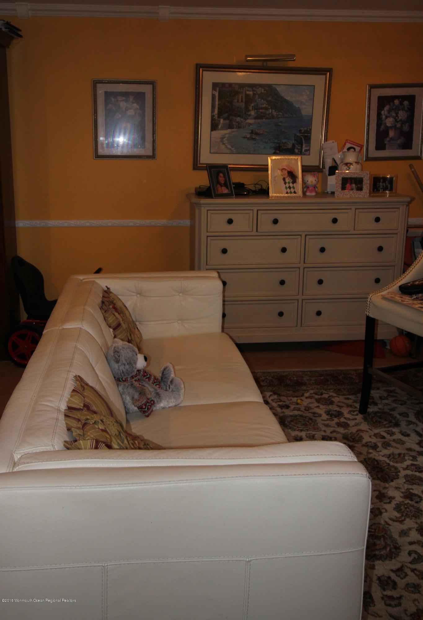 2007 Ridgeview Court, Unit 2007 Parlin, NJ 08859 - Photo 9 of 21 a bed room with a bed and a dresser