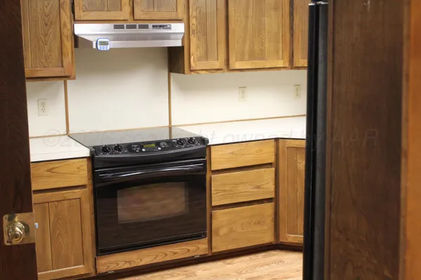 a kitchen with a stove and a microwave