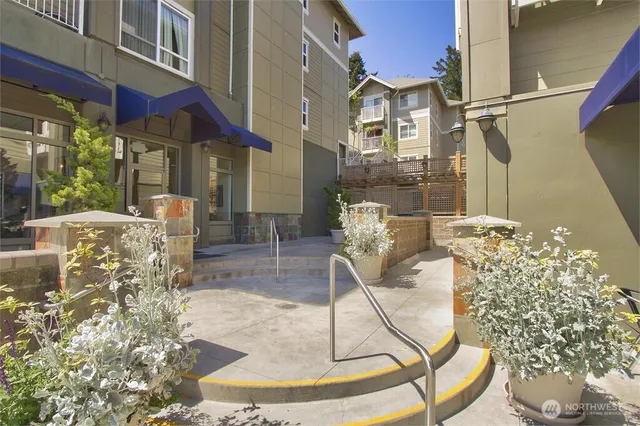 a view of kitchen with a sink and a mirror