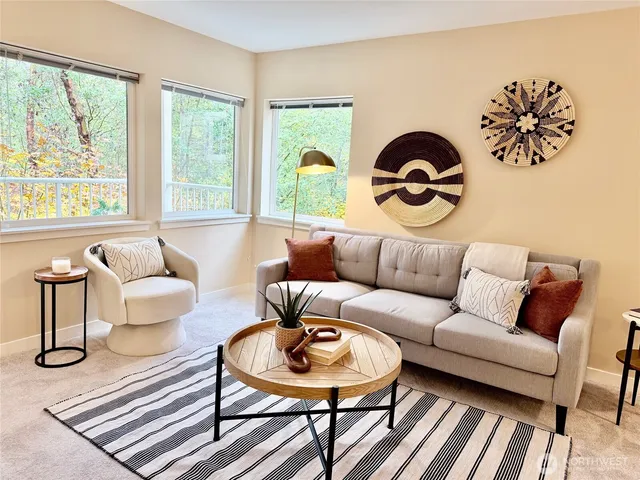 a kitchen with sink cabinets and living room