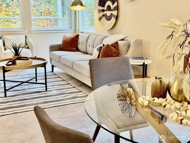 a view of a dining room with furniture and wooden floor