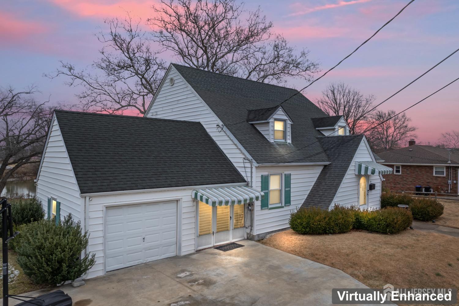 28 River Road East Brunswick, NJ 08816 - Photo 45 of 46 a front view of a house with a yard