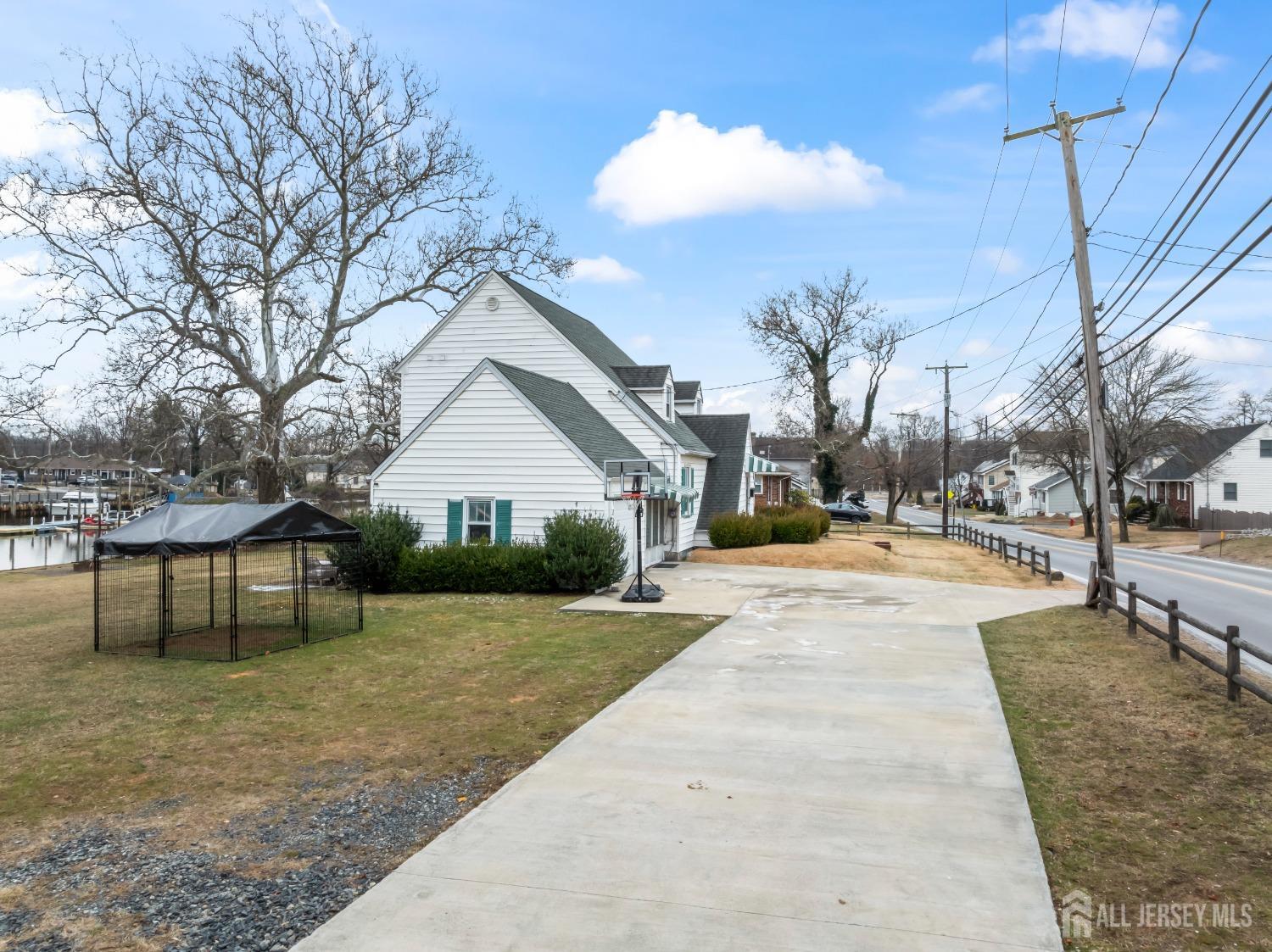 28 River Road East Brunswick, NJ 08816 - Photo 5 of 46 a view of a house with yard and a tree