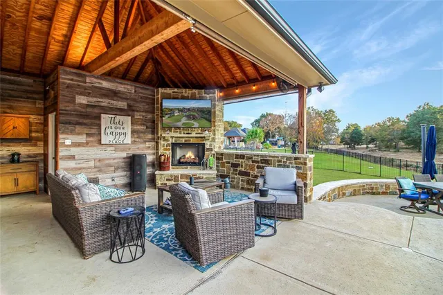 a view of a patio with a table and chairs
