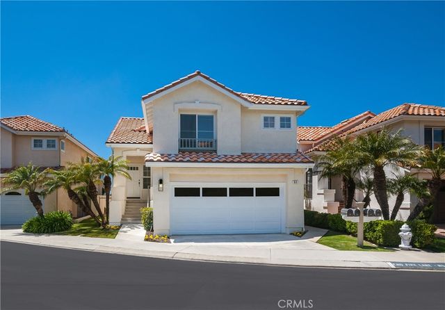 a front view of a house with yard