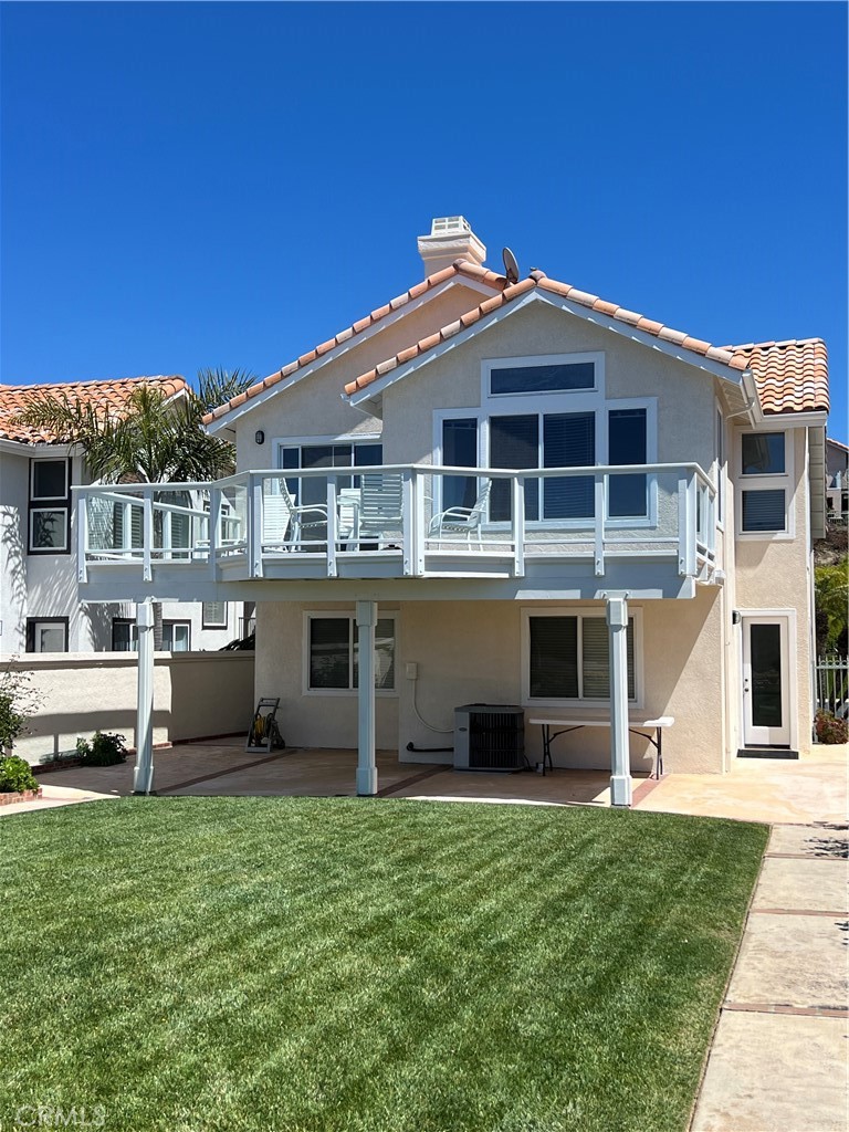 51 Santa Lucia Dana Point, CA 92629 - Photo 11 of 50 a front view of a house with a yard