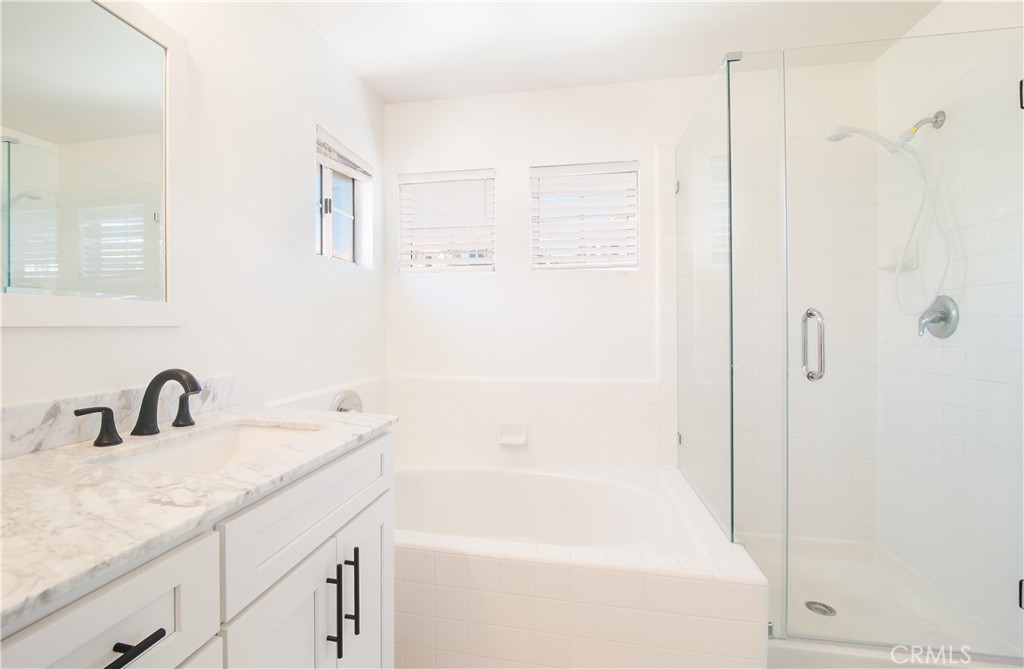 51 Santa Lucia Dana Point, CA 92629 - Photo 12 of 50 a bathroom with a granite countertop sink a shower and a mirror