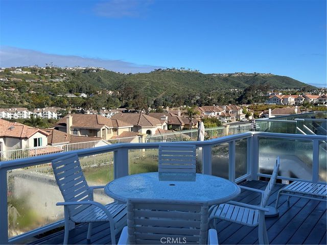 a view of a chairs and table in patio